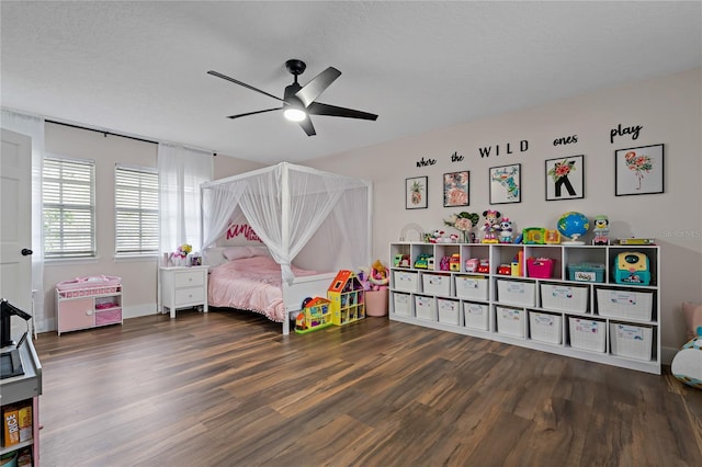 bedroom featuring wood-type flooring, a textured ceiling, and ceiling fan