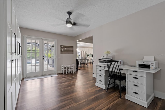 office area with dark wood-type flooring, a textured ceiling, ceiling fan, and french doors