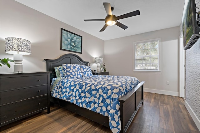 bedroom with ceiling fan and dark hardwood / wood-style flooring