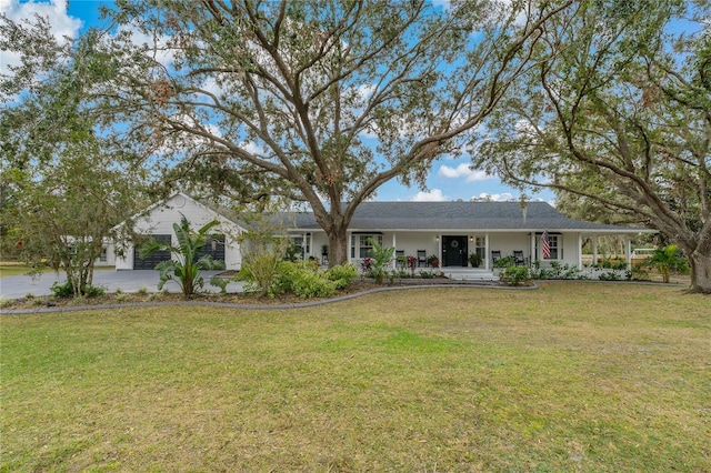 ranch-style house featuring a porch and a front lawn