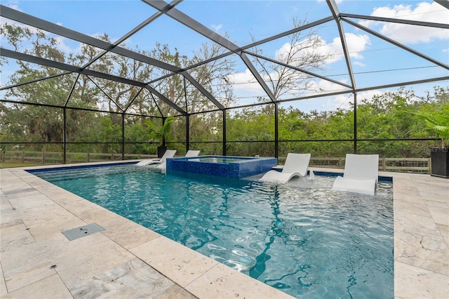 view of pool with a lanai, an in ground hot tub, and a patio area