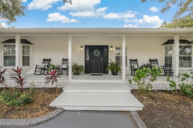 entrance to property with a porch