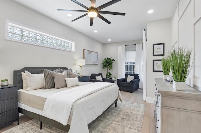 bedroom with light wood-type flooring and ceiling fan