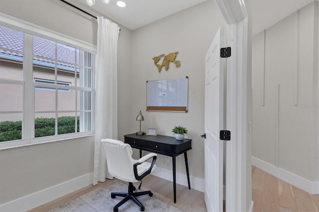 office space with light wood-type flooring