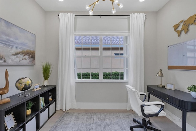 home office with a notable chandelier