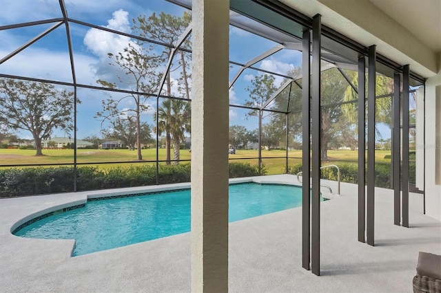 view of swimming pool with a patio and glass enclosure