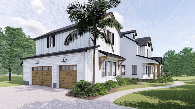 view of home's exterior with a garage and a lawn