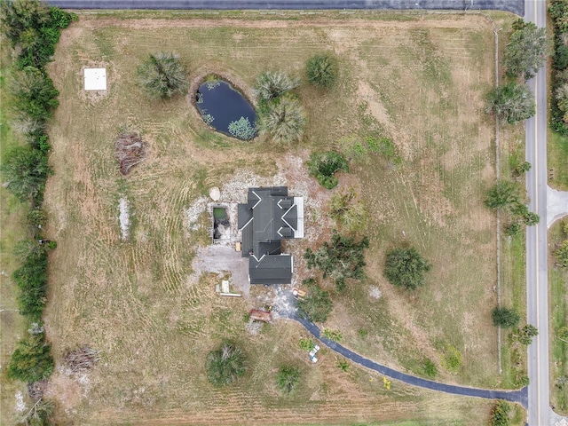 aerial view with a rural view and a water view