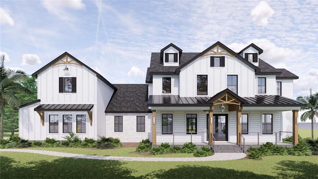 639 Oakford Rd, Sarasota, FL 34240 - modern farmhouse style home featuring a standing seam roof, a porch, board and batten siding, and a front lawn