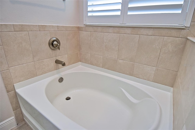 bathroom with a tub