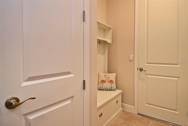 mudroom with light tile patterned flooring