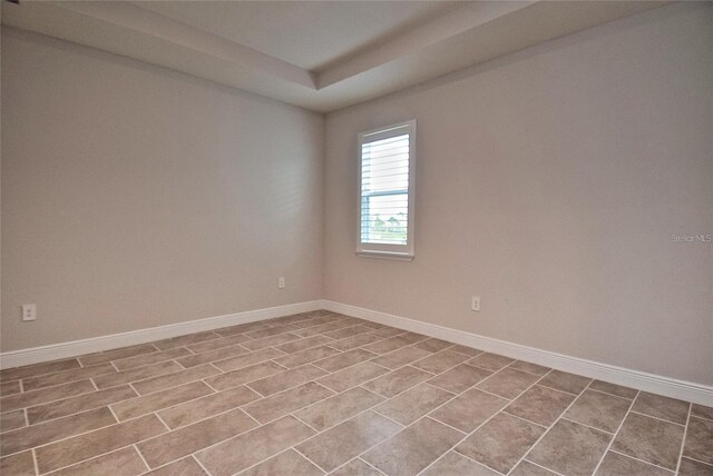 empty room featuring light tile patterned floors