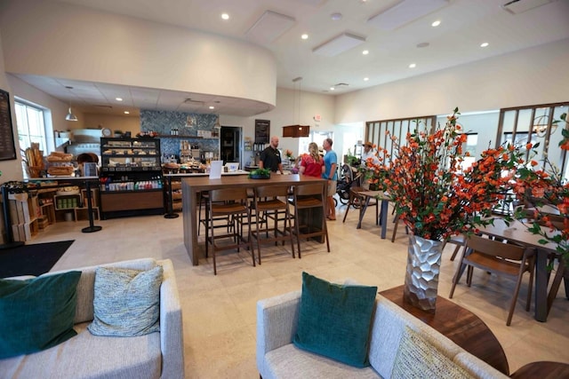 dining space featuring a high ceiling