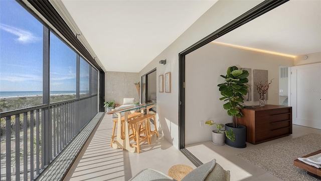 balcony with a view of the beach and a water view