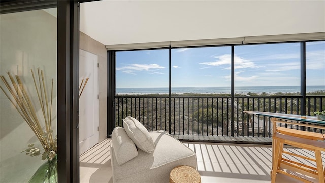 sunroom with a water view