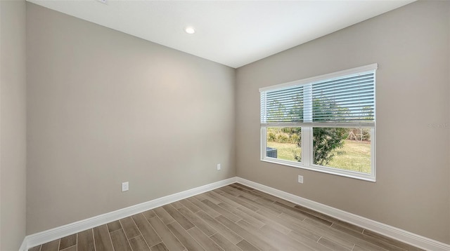 spare room with light wood-type flooring