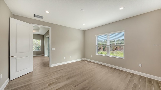 unfurnished room featuring light hardwood / wood-style flooring