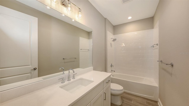 full bathroom featuring toilet, bathtub / shower combination, and vanity