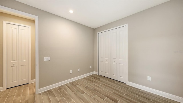 unfurnished bedroom with light wood-type flooring