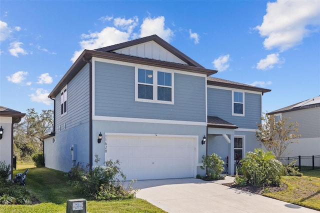 view of property with a front lawn and a garage