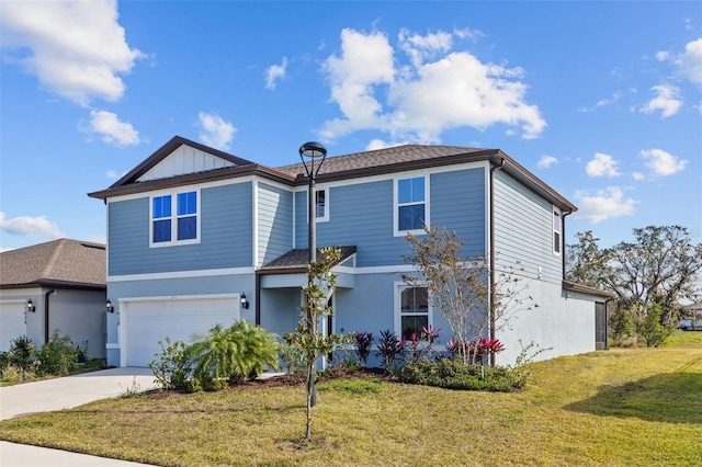 view of front of house with a front yard and a garage