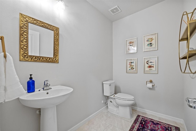 bathroom featuring toilet