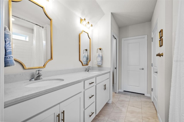 bathroom with vanity and tile patterned flooring