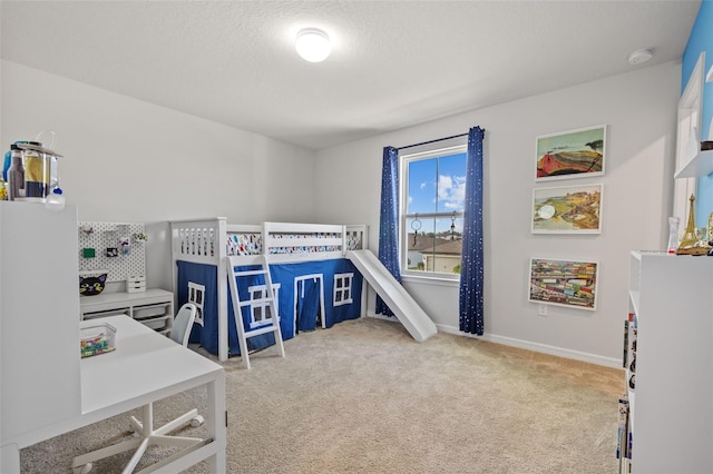 carpeted bedroom featuring a textured ceiling