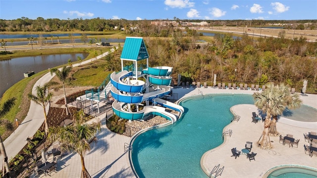 view of swimming pool featuring a water view and a water slide