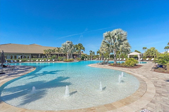 view of swimming pool with a gazebo and pool water feature