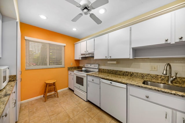 kitchen with white appliances, tasteful backsplash, ceiling fan, white cabinets, and sink