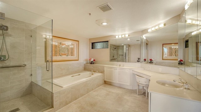 bathroom featuring vanity and separate shower and tub