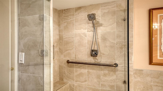 bathroom with tiled shower