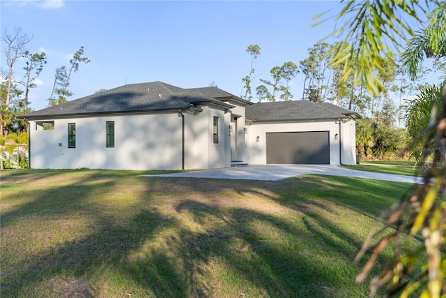 view of front of house with a front lawn and a garage