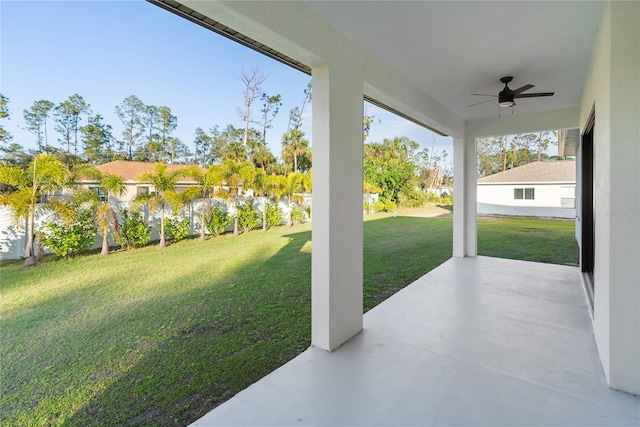 view of yard featuring ceiling fan and a patio