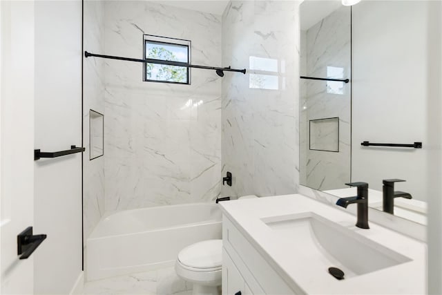 full bathroom featuring toilet, tiled shower / bath combo, and vanity