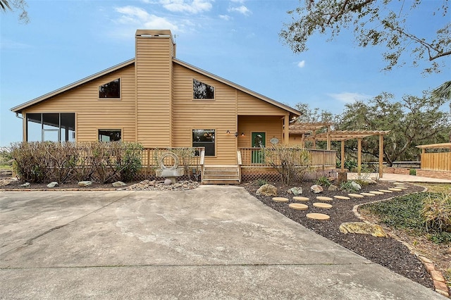 exterior space featuring a deck and a pergola