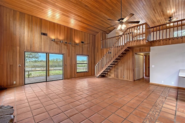 unfurnished living room featuring high vaulted ceiling, ceiling fan, light tile patterned flooring, and wooden ceiling