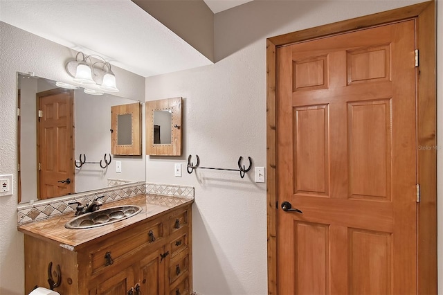 bathroom featuring backsplash and vanity