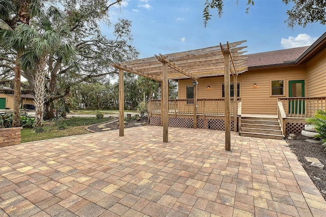 view of patio with a wooden deck and a pergola