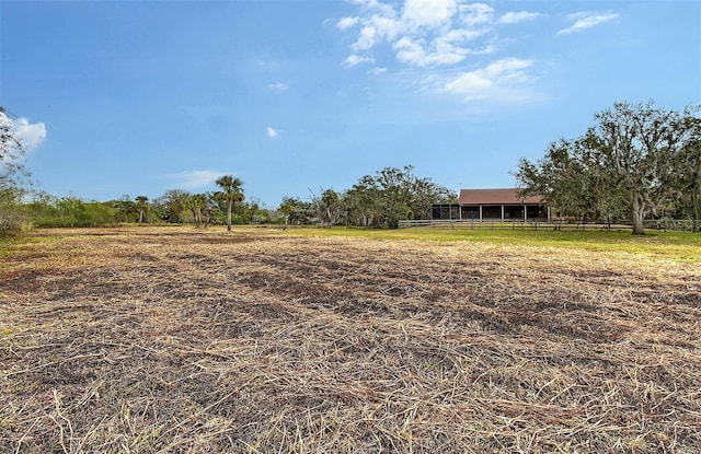 view of yard with a rural view