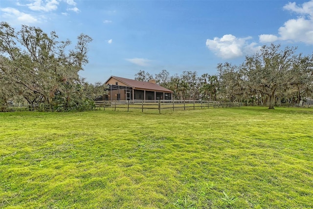 view of yard with a rural view