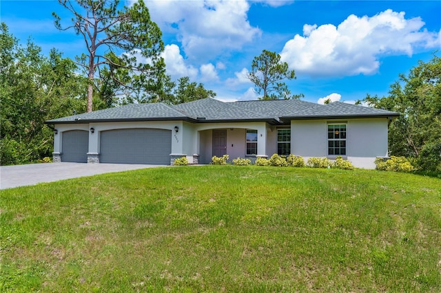 single story home with a front yard and a garage