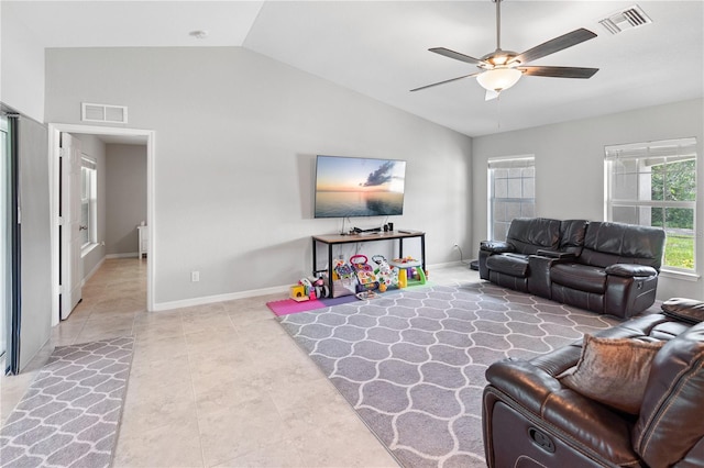 living room featuring ceiling fan and vaulted ceiling