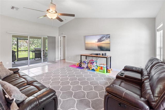 living room with lofted ceiling, tile patterned flooring, and ceiling fan