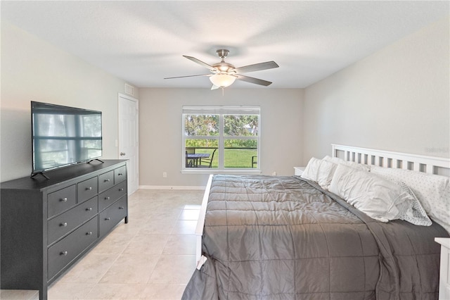 bedroom featuring ceiling fan and light tile patterned floors