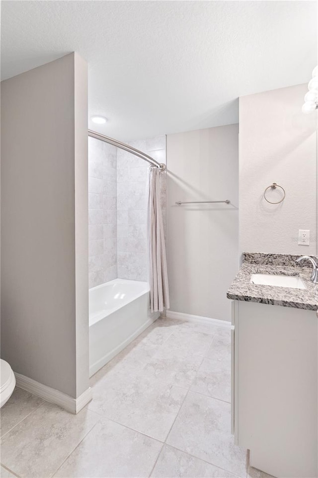 full bathroom featuring toilet, a textured ceiling, shower / bath combo, and vanity