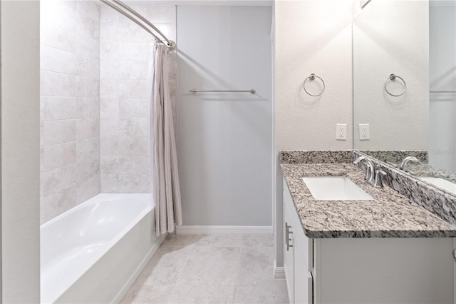 bathroom with vanity, tile patterned floors, and shower / bath combo with shower curtain