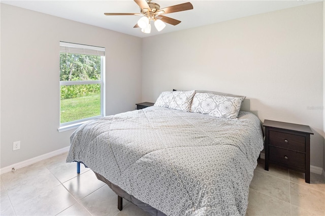 bedroom featuring ceiling fan and light tile patterned floors