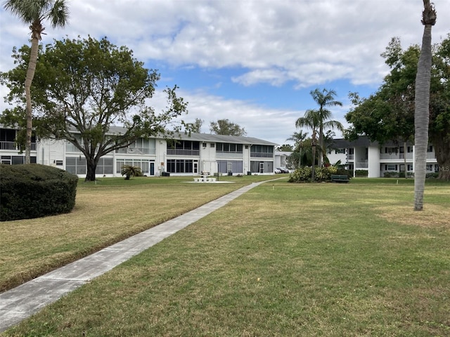 view of home's community featuring a yard